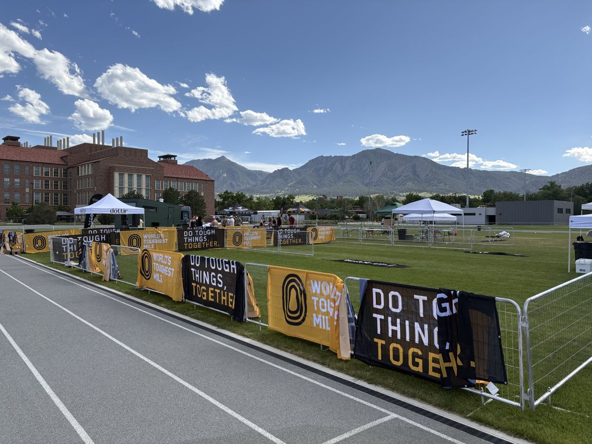 Tribute Fencing & Barricade barricades with sponsor banners lining the course at a race event
