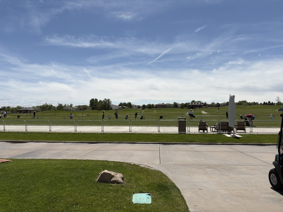 Temporary fencing around the driving range at the Colorado Open