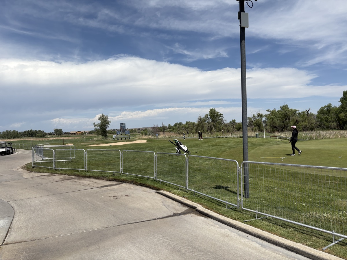 Temporary fence line following the course contour at the Colorado Open